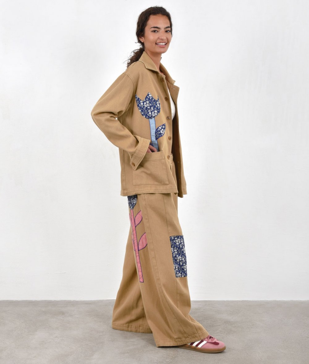 Pants with appliqued flowers