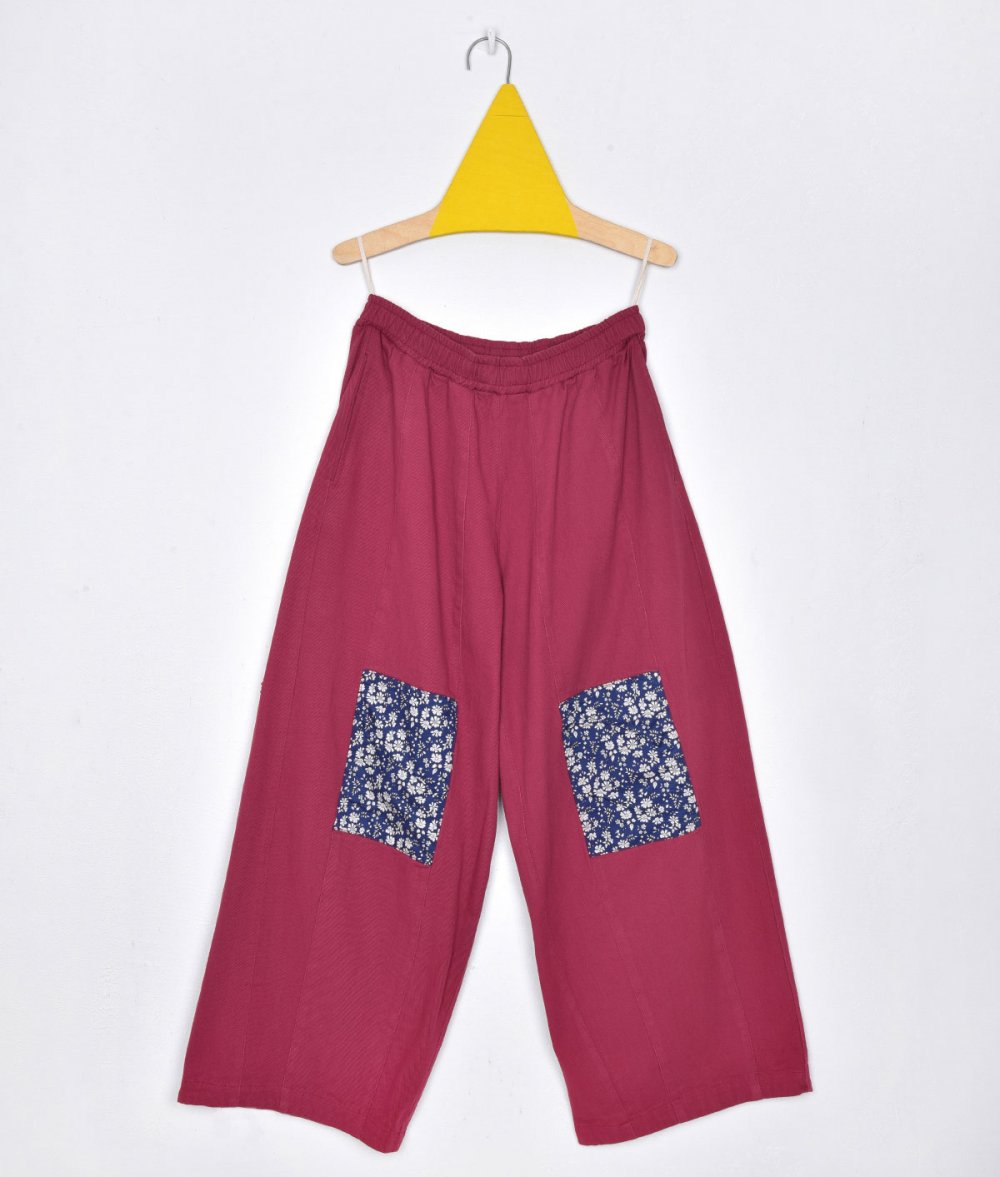 Pants with appliqued flowers